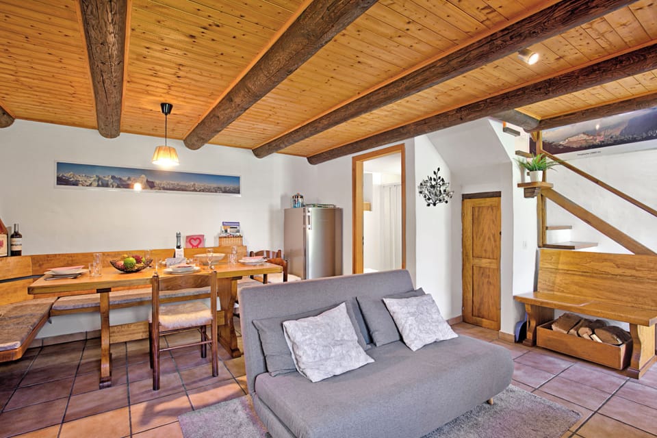 Family Chalet, Multiple Bedrooms, Mountainside (Rustico Ca del Pol) | Living area | Flat-screen TV, fireplace