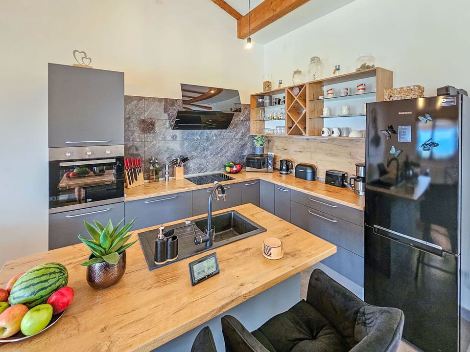 Cabinetry, Table, Countertop, Furniture, Flowerpot, Kitchen, Houseplant, Couch, Lighting, Interior Design