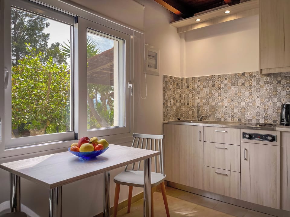 Mini-fridge, stovetop, cookware/dishes/utensils