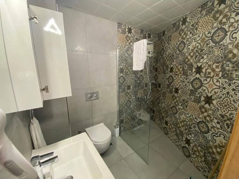 Comfort Quadruple Room, Balcony, Beach View | Bathroom | Shower, free toiletries, hair dryer, towels