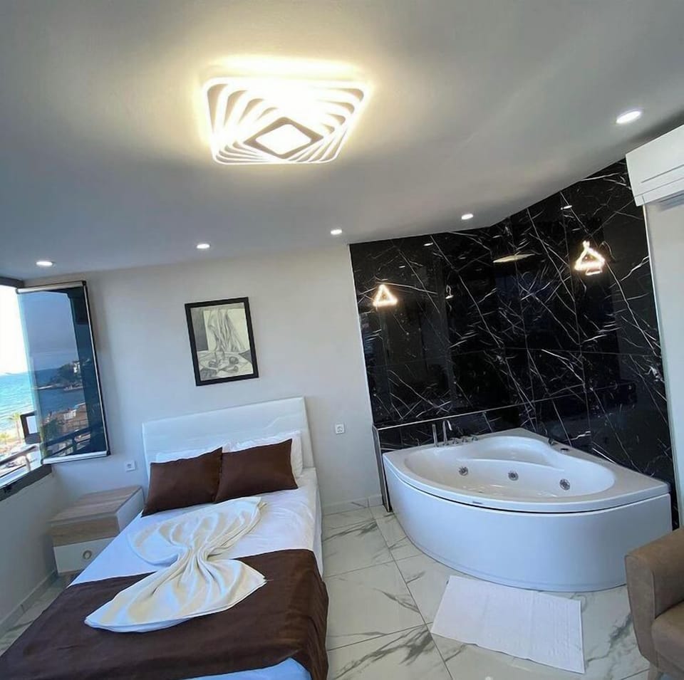 Comfort Quadruple Room, Balcony, Beach View | Bathroom | Shower, free toiletries, hair dryer, towels