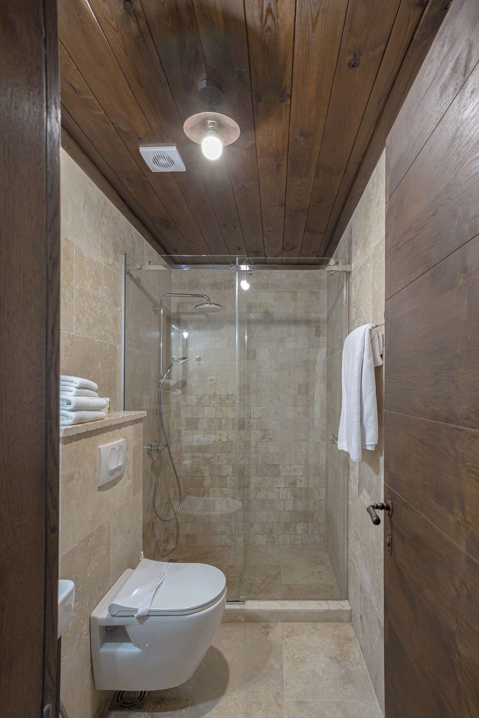 Shower, hair dryer, slippers, towels