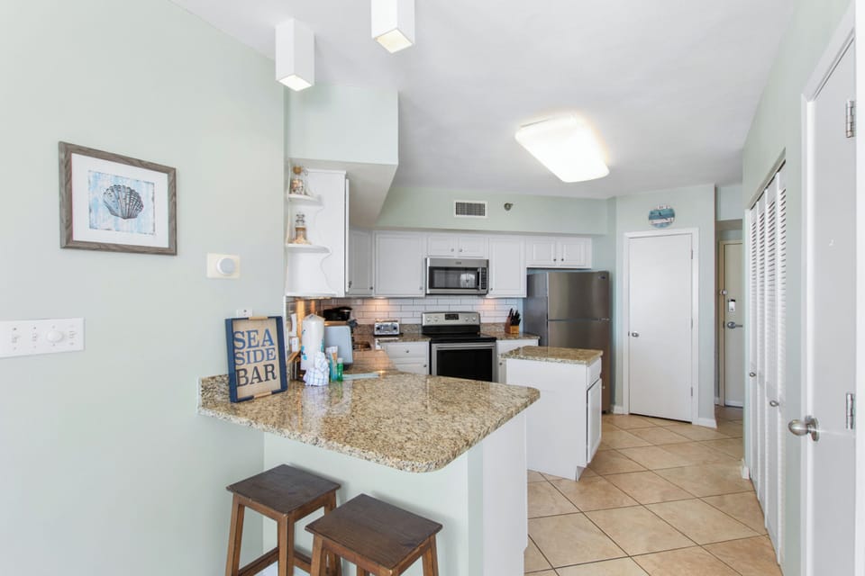 Signature Condo, Beach View | Private kitchen | Fridge, microwave, oven, stovetop