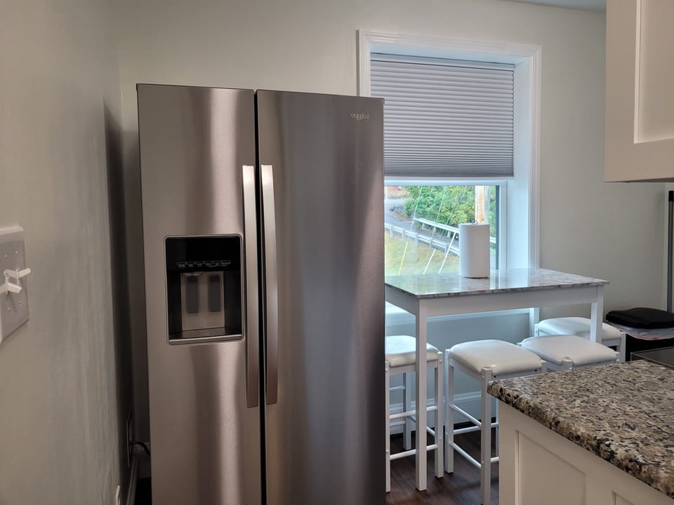 Kitchen with full sized appliances. 