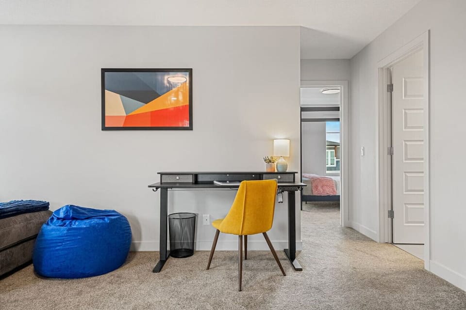 Upstairs games/second living area with a foosball table, smart TV, dedicated workstation & an assortment of board games.