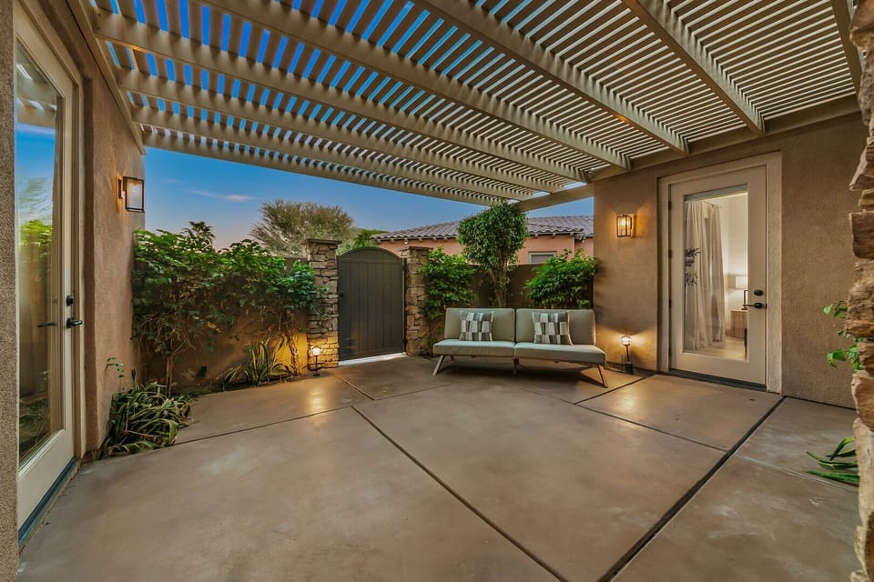 Welcome to your serene escape in the front courtyard! Enjoy the privacy of your own entrance and cozy up on the sofa, perfect for two or three. A charming spot to unwind and soak in the ambiance!