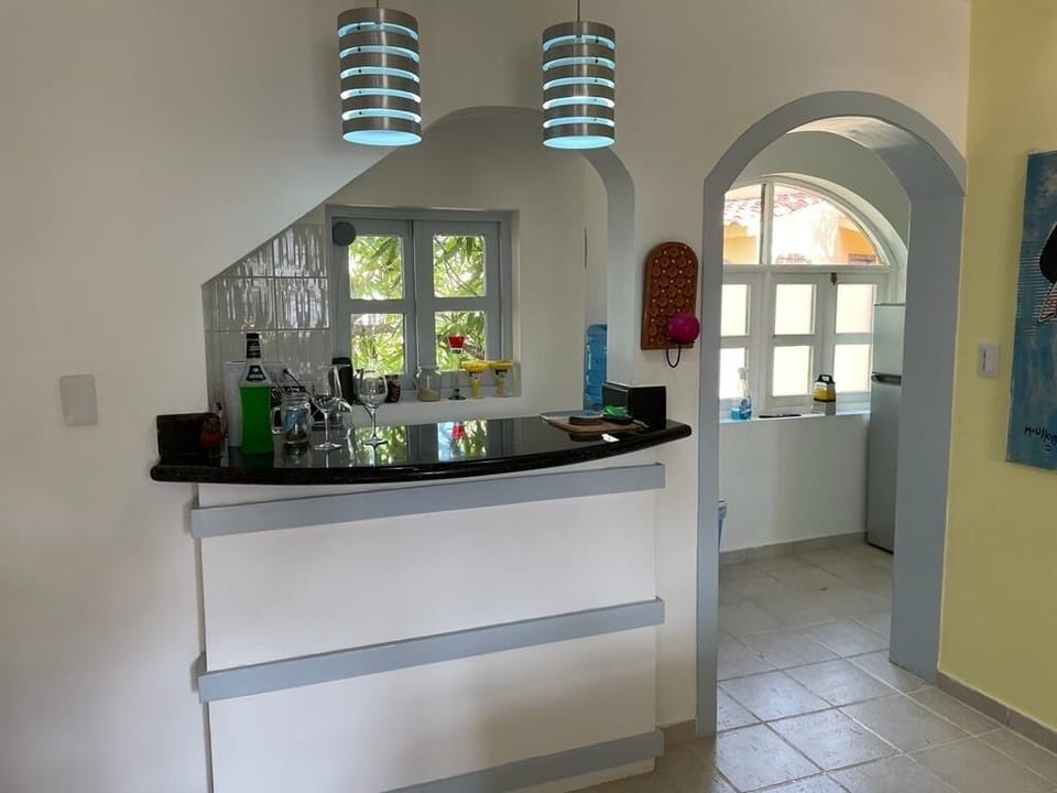 kitchen with microwave, gas stove, toaster oven, blender and coffee maker 