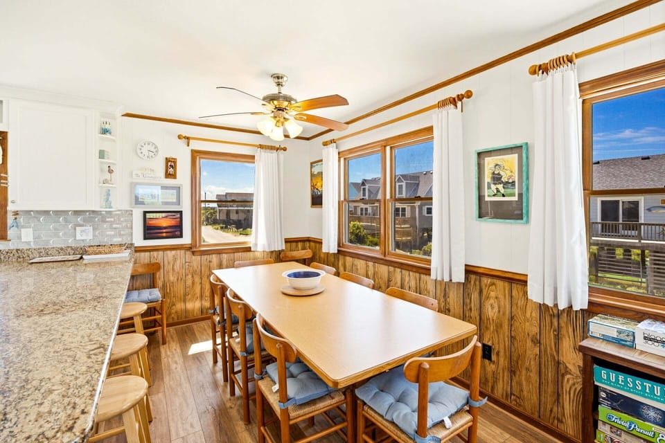 Enjoy your culinary creations in the adjacent dining area, where you can gather around the table for memorable meals together.