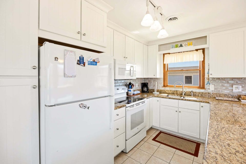 The well-equipped Kitchen features modern appliances and ample counter space, making meal preparation a breeze.
