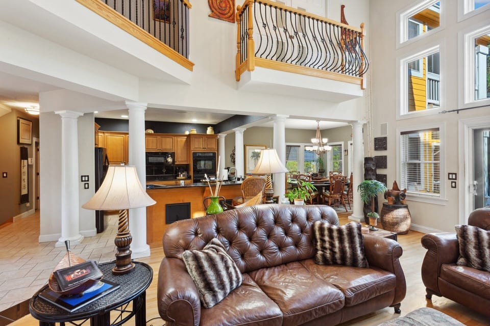 Relax in the spacious Living Area with high ceilings for soaking up the sunshine and plenty of cozy furniture.