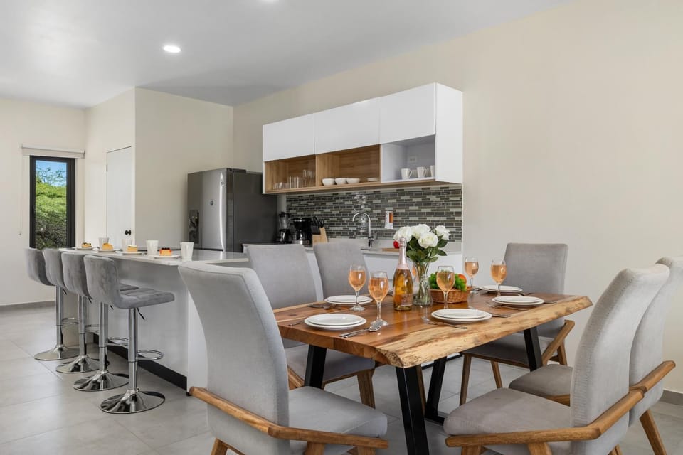 Gather around the spacious dining table with seating for six, perfect for family meals, game nights, or enjoying a meal with friends.