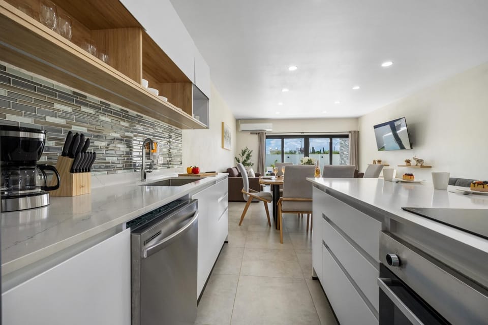 Fully equipped with modern appliances and all the essentials, our kitchen is ready for you to cook, dine, and feel at home during your stay.