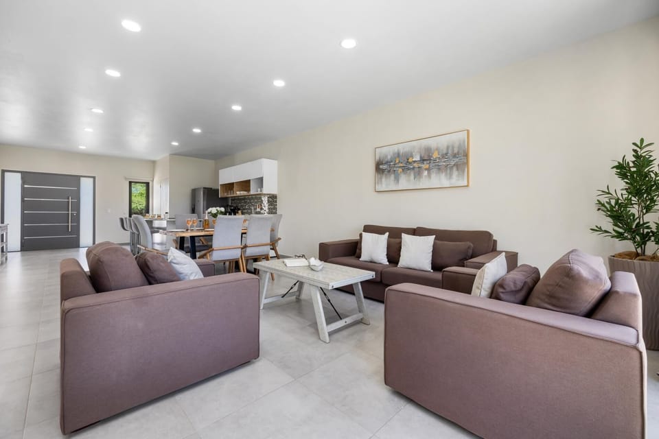 Relax in our cozy living room with oversized sofas, perfect for movie nights or spending time with loved ones.