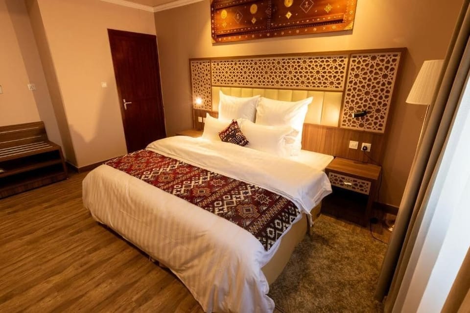 Premium bedding, desk, laptop workspace, iron/ironing board