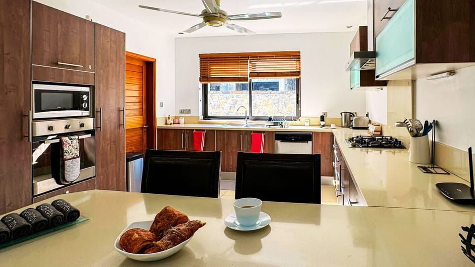 Family Apartment, Lagoon View | Private kitchen | Coffee/tea maker, electric kettle, highchair