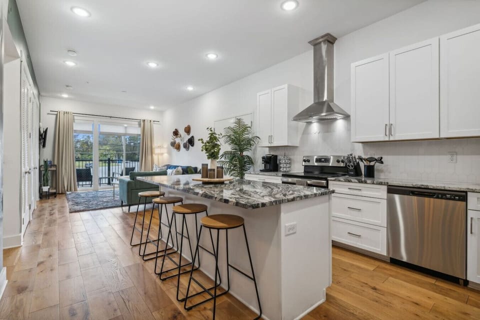 Granite countertops and large windows combine to create a bright, inviting space.