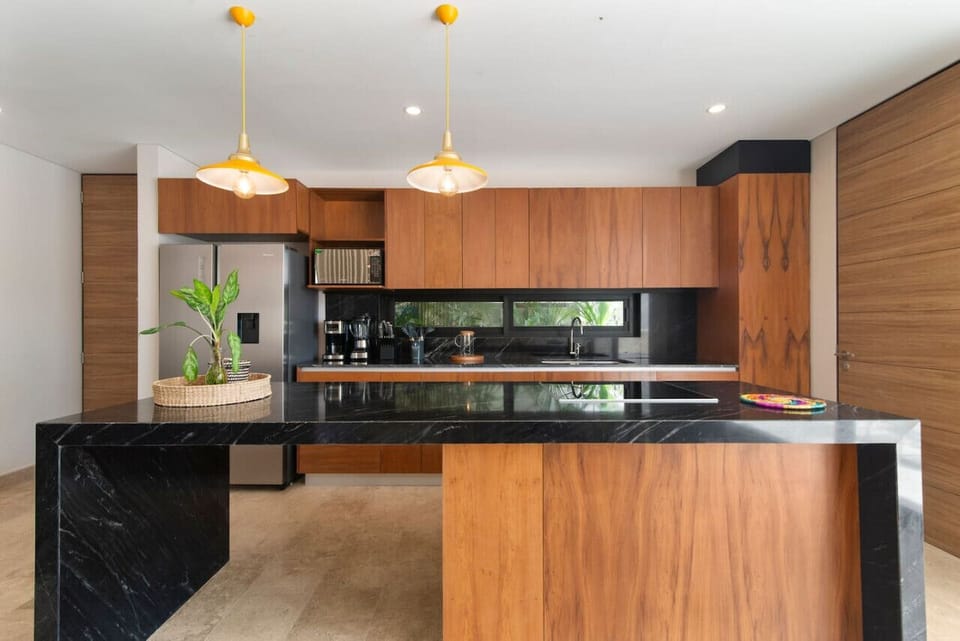 Gourmet Kitchen: Whip up culinary delights in this stylish kitchen with sleek finishes and natural light