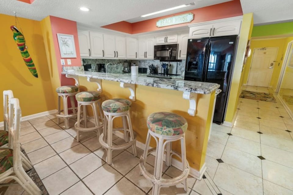 The kitchen counter provides additional  space for serving snacks or meals.