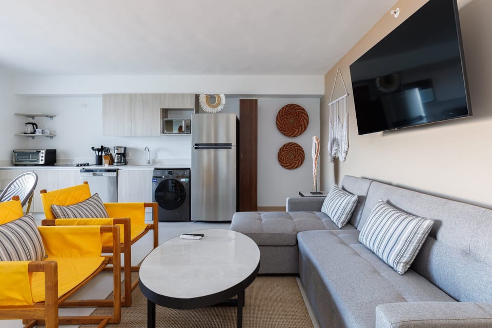 Enjoy a splash of color and modern comfort with ocean views just steps away.
