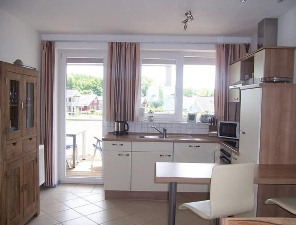 Apartment | Private kitchen | Electric kettle, toaster, highchair