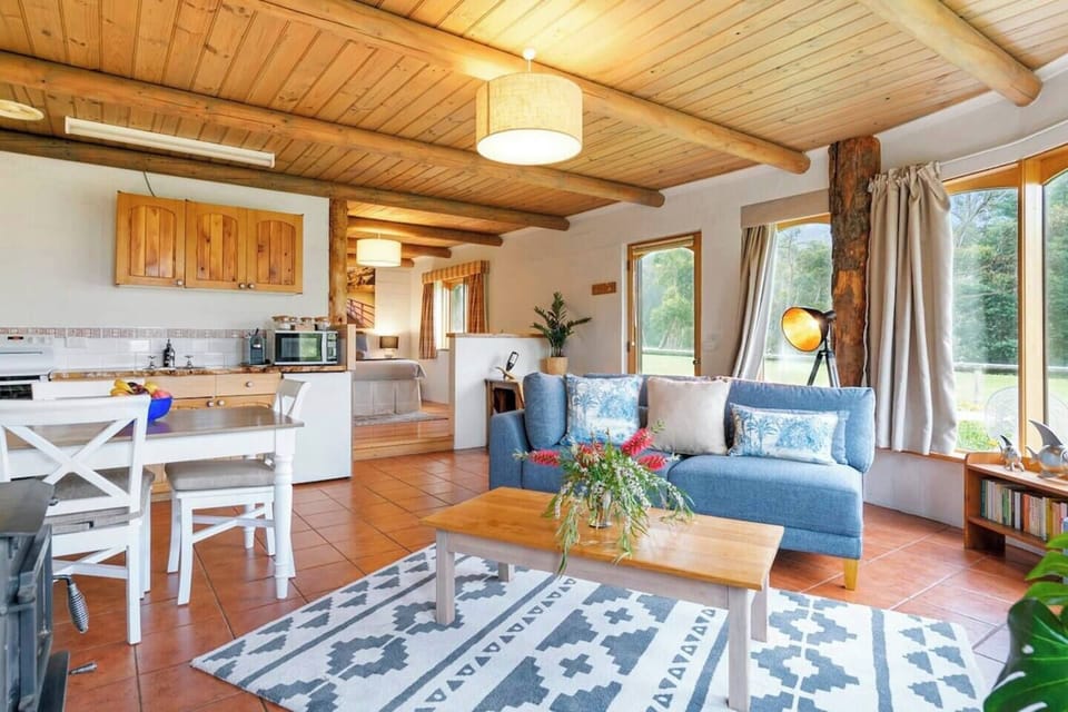 Natural light floods the space, offering views of the rolling lawns and the vineyard gardens.
