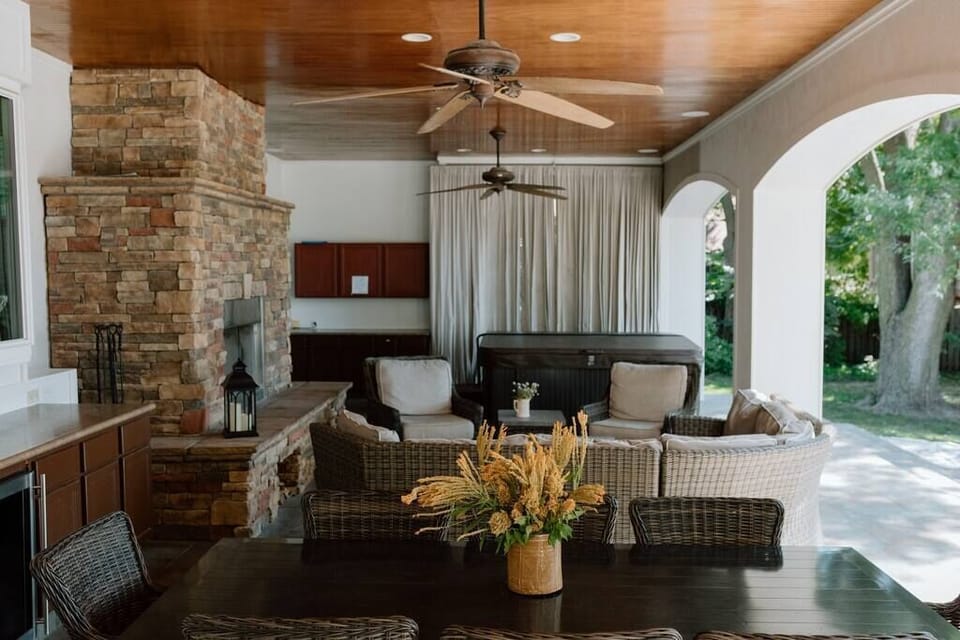 Outdoor living area with table, great comfortable patio furniture and hot tub!
