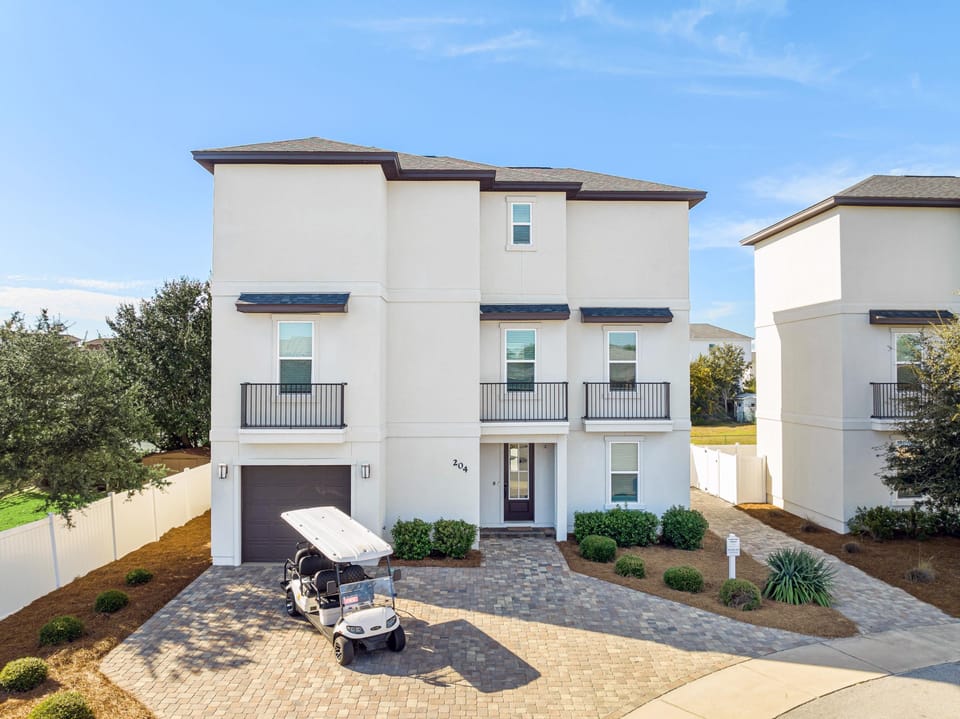Grand Vista Chateau features a large driveway and golf cart