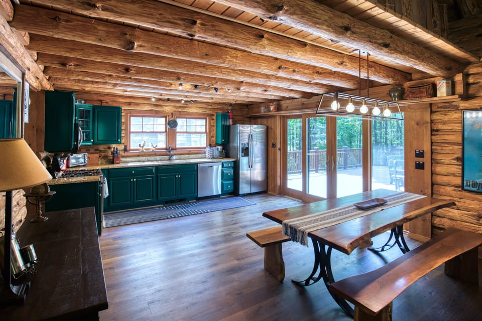 The kitchen opens directly out onto the large, newly rebuilt deck.