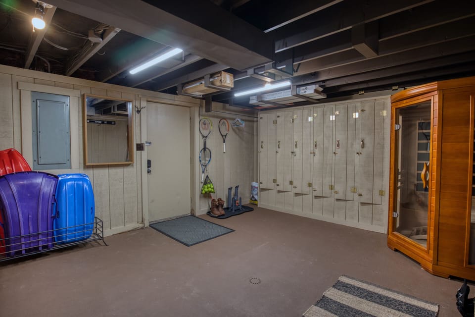 Ski locker room: code entry, drain, sauna, boot warmer. Hang gear to dry.
