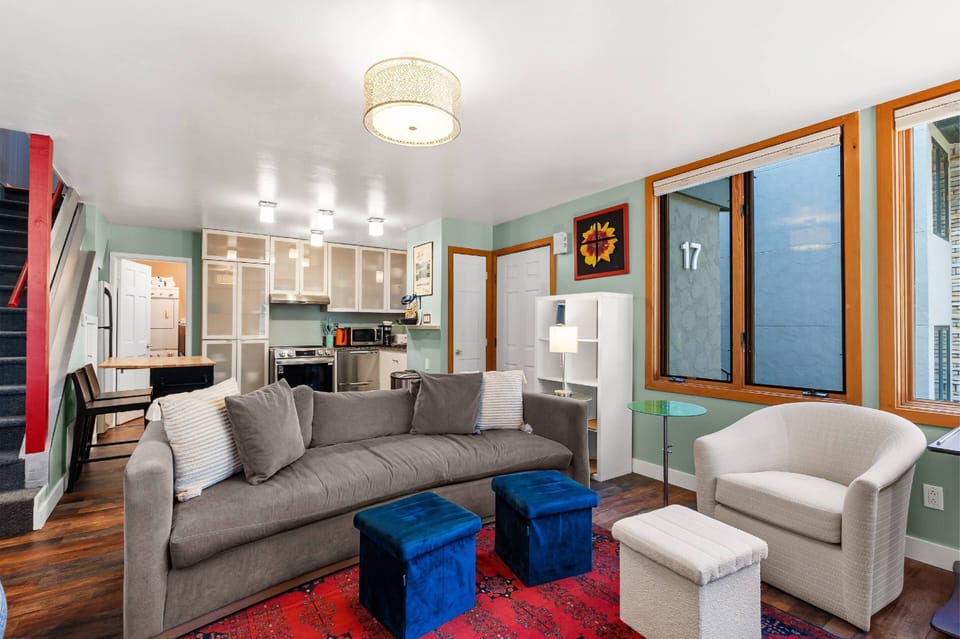 You will love the open concept, vibrant color palette and large windows in the main living and kitchen area.