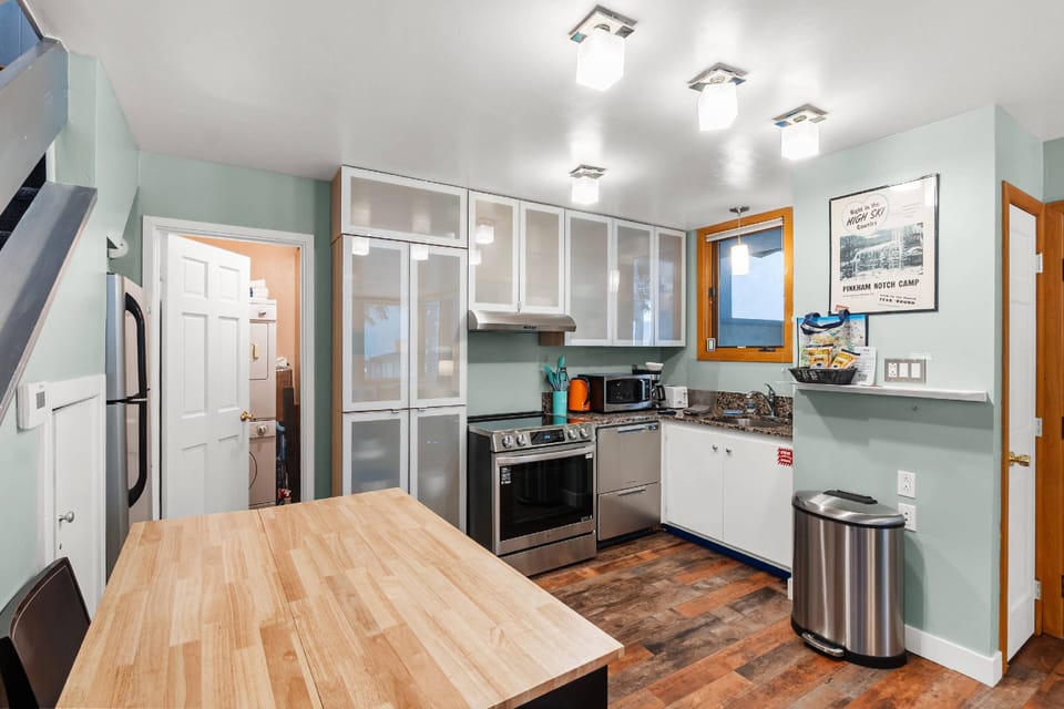 A fully stocked kitchen, breakfast bar for quick dining or remote working and a full size washer and dryer are some features found on the first floor.