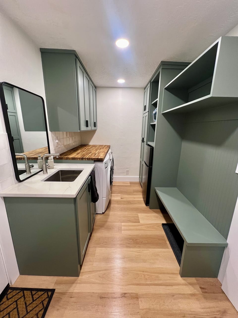 Laundry area.

Beverage fridge built in.