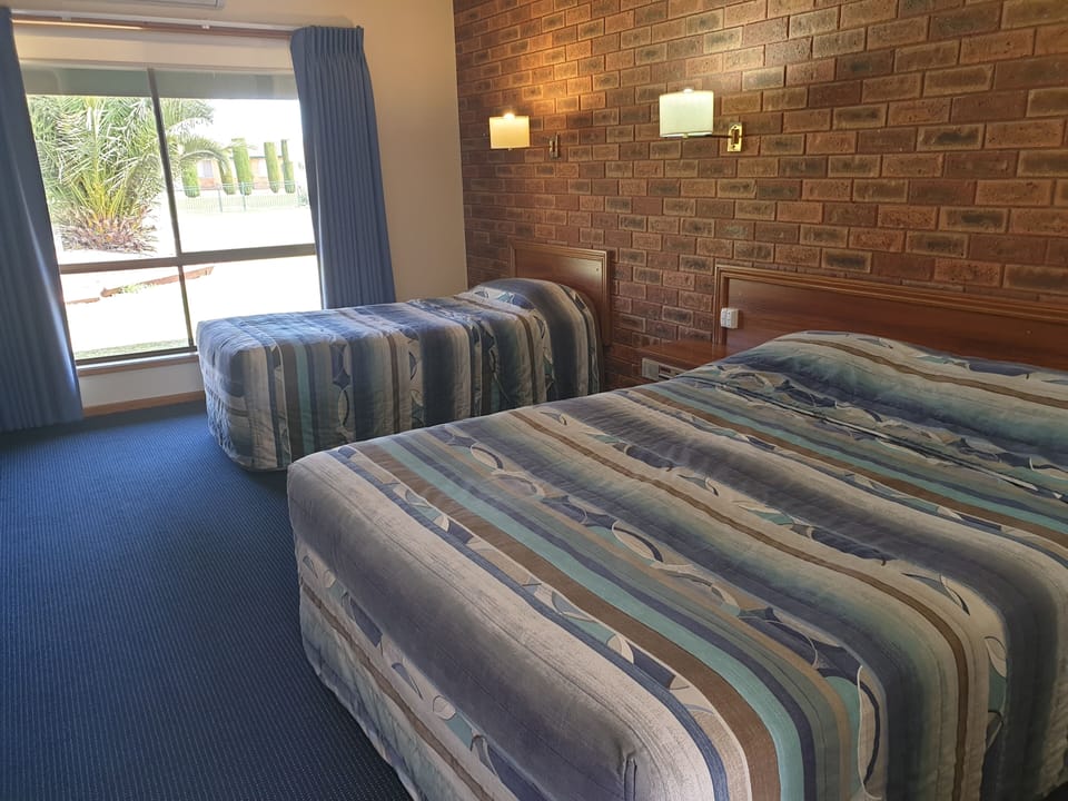 Twin Room | Desk, blackout drapes, iron/ironing board, travel crib