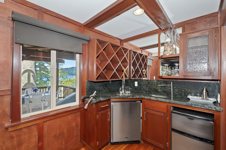 Wine room complete with a lake view