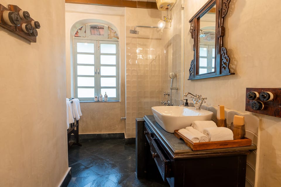 Zuari Room | Bathroom | Hair dryer, bathrobes, slippers, towels