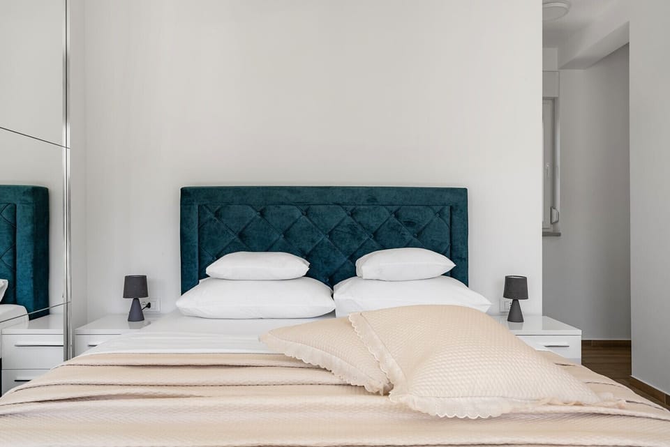 Bedroom No. 2 features a 160cm x 200cm queen-size bed, air conditioning, en-suite shower bathroom, a shared terrace