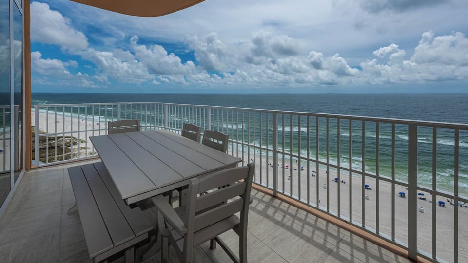Relax at the balcony table and feel the gulf breeze while watching waves roll along the beach
