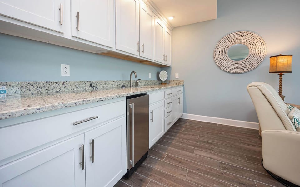 Grab a chilled drink from the fridge or create your favorite cocktail at the wet bar