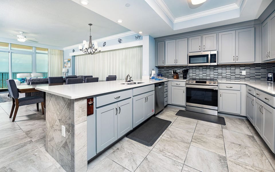 Upgrade your culinary experience in this stylish kitchen with modern stainless appliances and elegant design