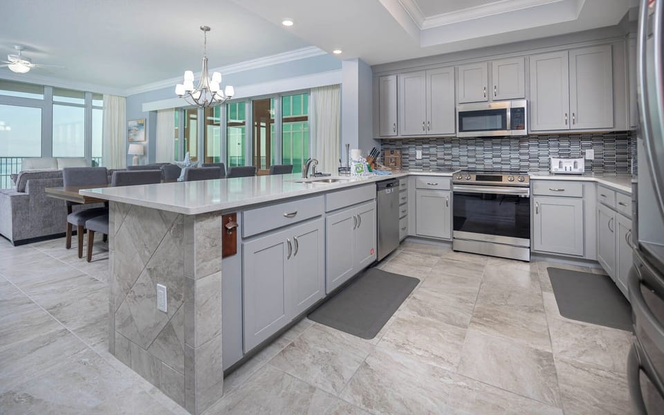 Upgrade your culinary experience in this stylish kitchen with modern stainless appliances and elegant design