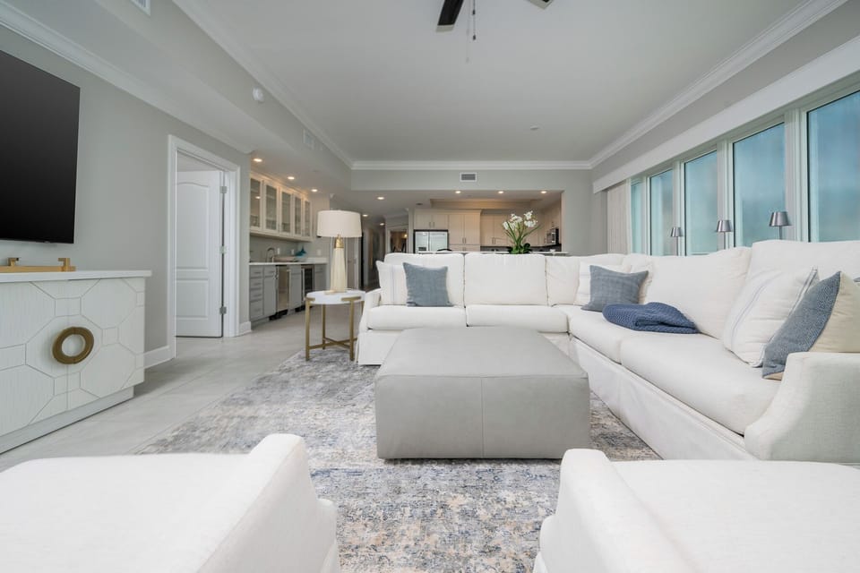 Stretch out on the large sectional, prop your feet on the ottoman, and stream shows while the gulf glimmers