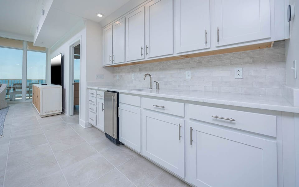 Grab a chilled drink from the fridge or create your favorite cocktail at the wet bar