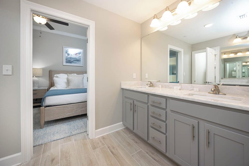 Freshen up in this guest bath in the relaxing shower or soothing tub before an exciting beach day