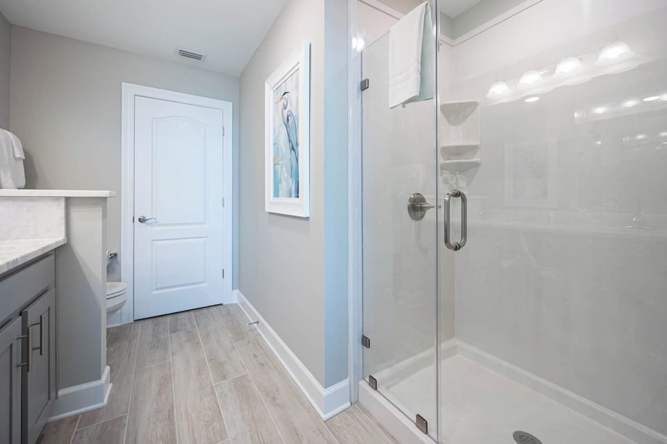 Indulge in relaxation in the master bath with a refreshing walk-in shower