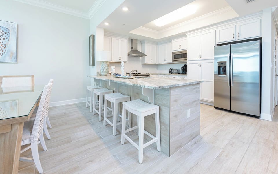 Sip your morning coffee at the breakfast bar and get ready for a beach day in this stylish space
