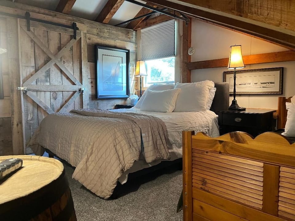 Bedroom photo inside Basecamp lodge. Includes One Queen Bed and One Twin Bed. 