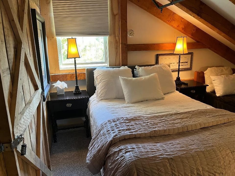 Additional photo of bedroom inside Basecamp lodge Includes queen and twin bed.
