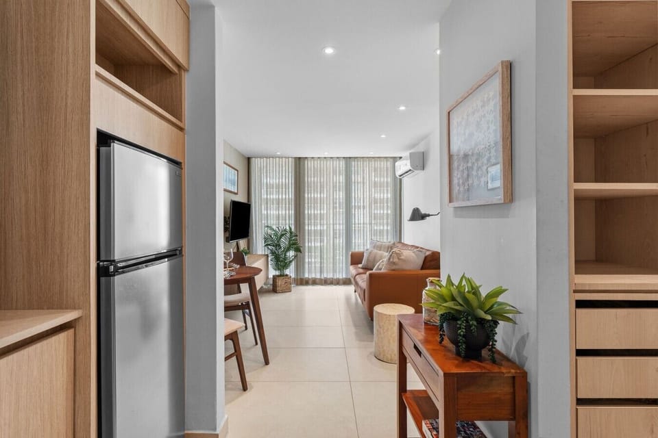 Open the balcony sliding doors to Isla Verde beach views