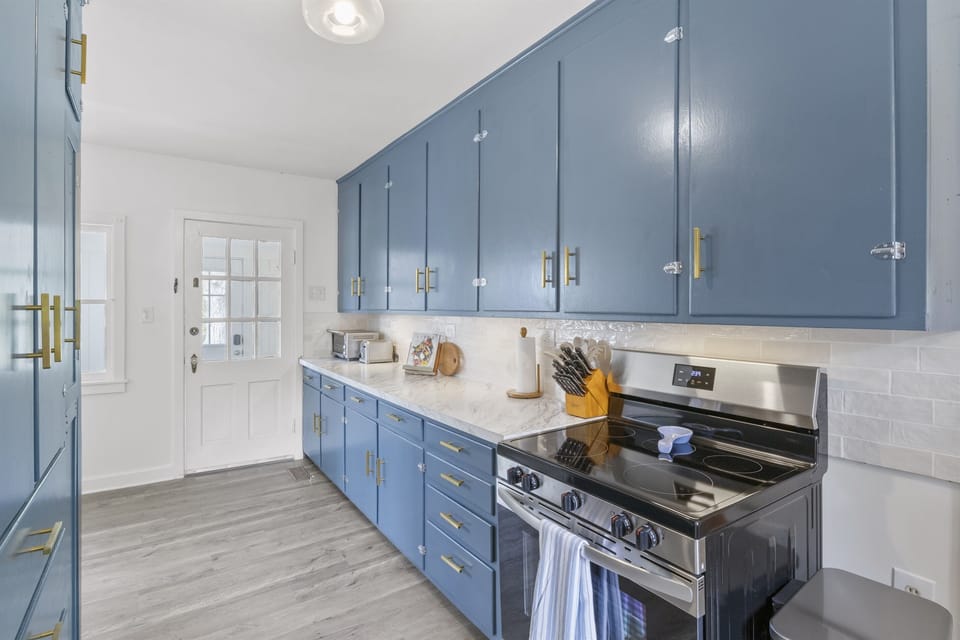 This bright, fully stocked kitchen offers everything you need—modern appliances, abundant cabinetry, and plenty of prep space—making it easy to cook meals and gather with friends and family during your Finger Lakes stay.