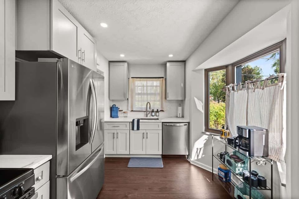 Sleek kitchen w/ stainless appliances & long counters for cooking